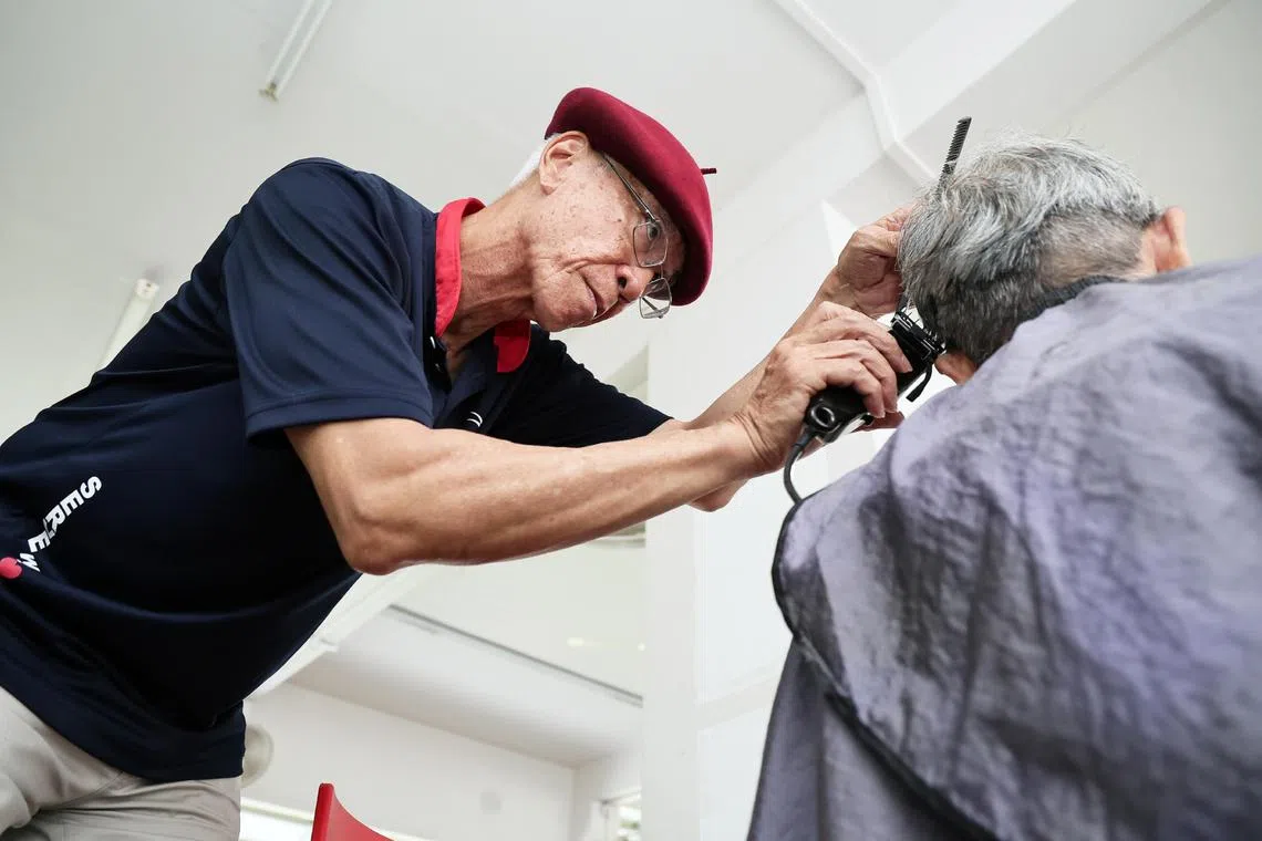 Armed with scissors, shavers and combs, retired wealth advisor Mark Yuen, 69, provides free hairdressing service at various places.