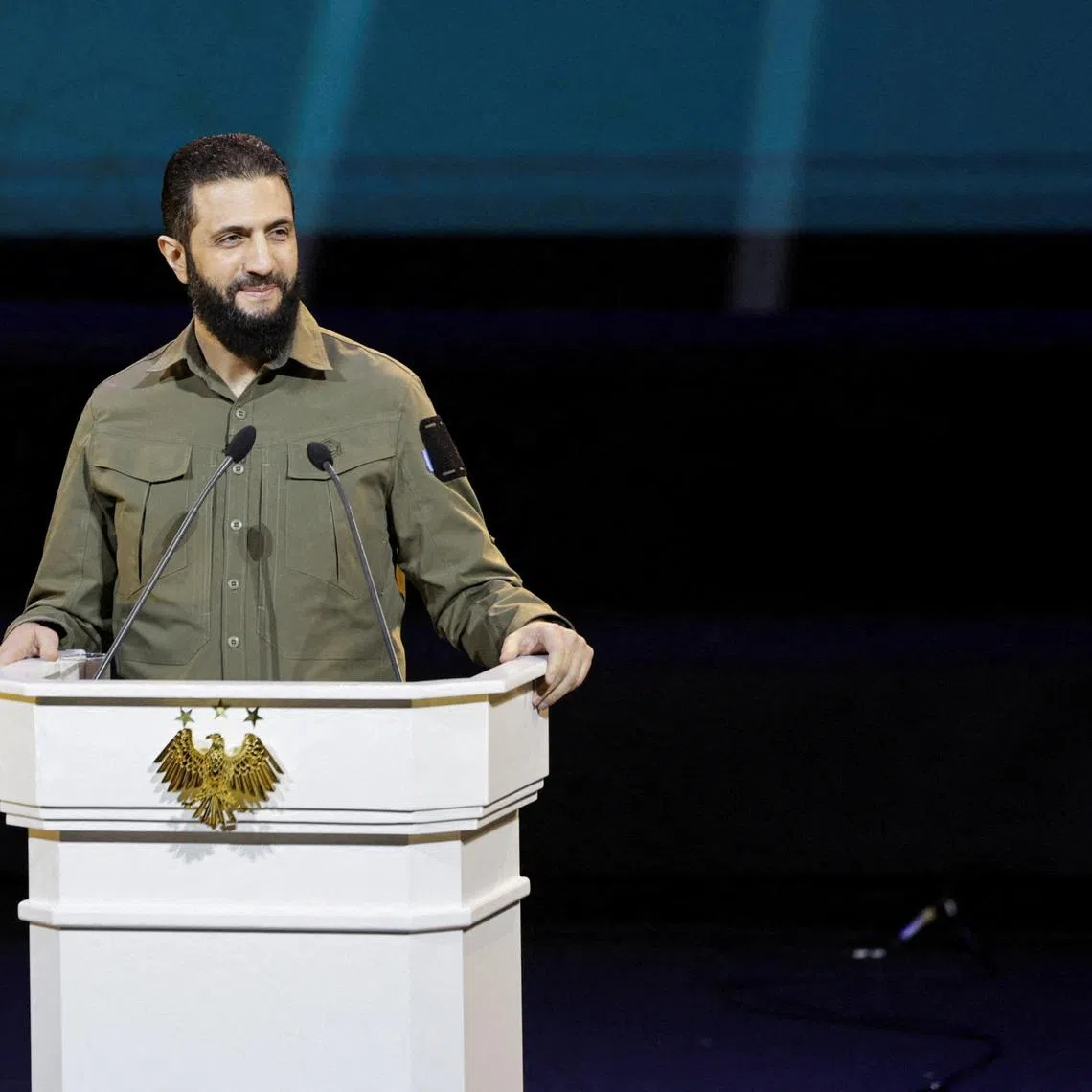 FILE PHOTO: Syria's President Ahmed al-Sharaa delivers a speech on the first anniversary of Bashar al-Assad's fall, in Damascus, Syria December 8, 2025. REUTERS/Khalil Ashawi/File Photo