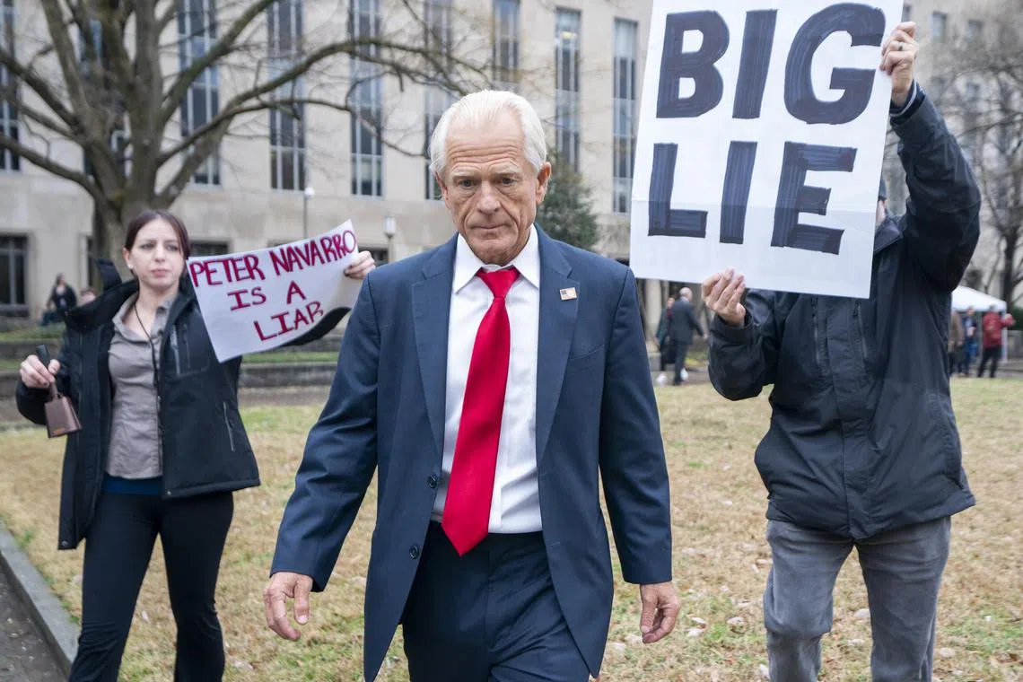 epa11104185 Peter Navarro (C), former advisor to former US President Donald Trump, departs after speaking to the news media at the E. Barrett Prettyman United States Courthouse in Washington, DC, USA, 25 January 2024. Navarro was sentenced to four months in prison for criminal contempt of Congress.  EPA-EFE/SHAWN THEW
