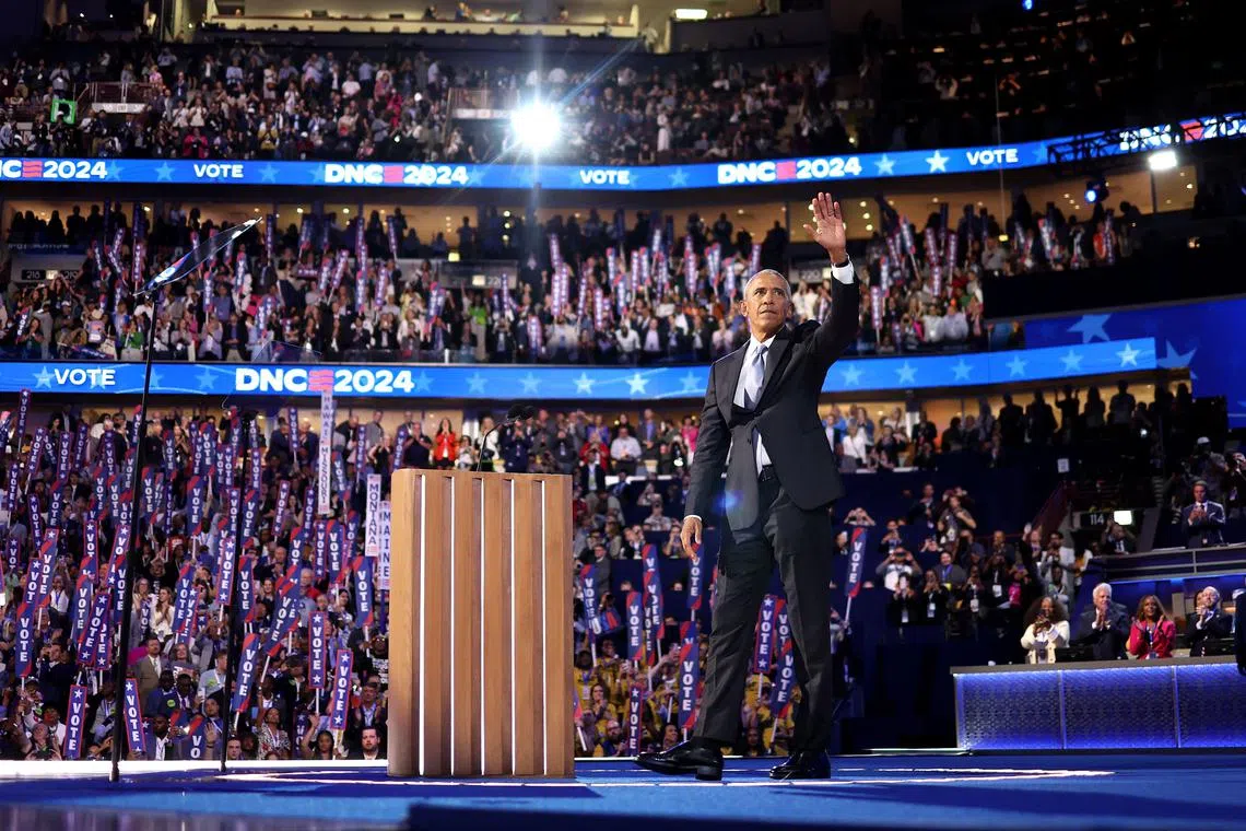 Former US President Barack Obama waves after speaking on the second day of the Democratic National Convention on Aug 20.