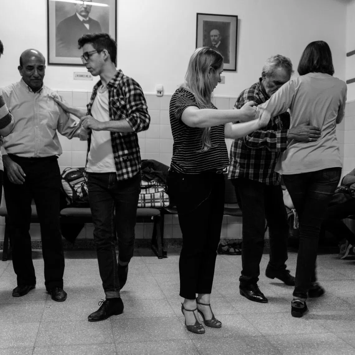 Manuel Firmani, centre left, is a professional tango dancer who leads the workshops, along with Veronica Litvak, centre right. 