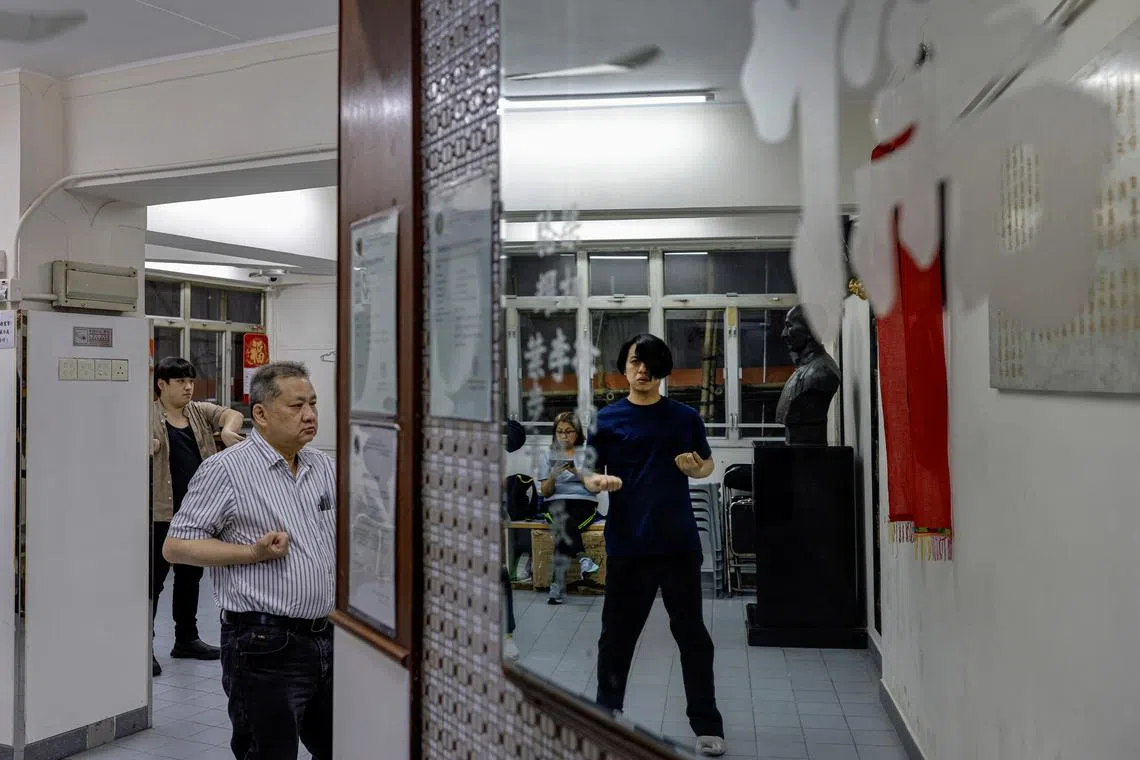 Wing Chun students Noah Ng, 31, Bill Wong, 55, Dorothy Tam, 60, and Simon Yeung, 40, practicing at a Wing Chun school on April 25.