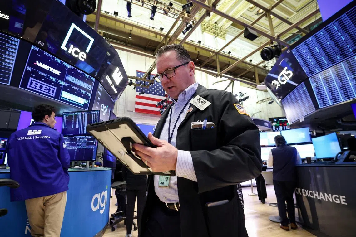 Traders working on the floor of the New York Stock Exchange, in New York City, on Feb 11.