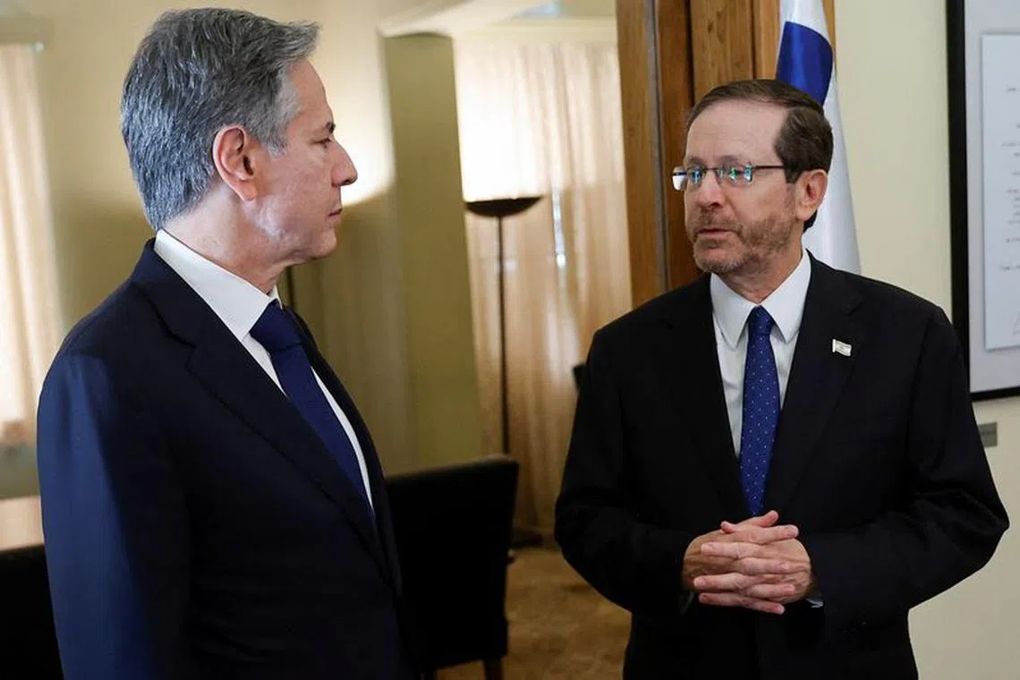 U.S. Secretary of State Antony Blinken meets with Israeli President Isaac Herzog, during his visit to Israel, amid the ongoing conflict between Israel and the Palestinian Islamist group Hamas, in Tel Aviv, Israel November 3, 2023. REUTERS/Jonathan Ernst/Pool/File Photo