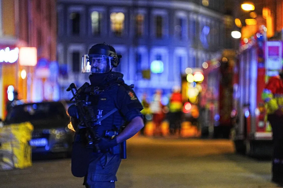 An armed police officer standing guard in Oslo on Sept 23, after reports of an explosion.
