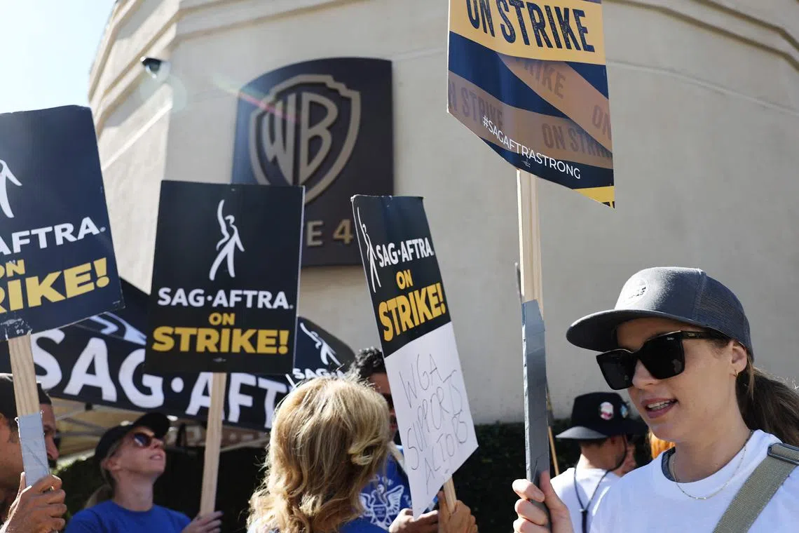 Striking SAG-AFTRA members picket outside Warner Bros. Studio as the actors strike continues in Burbank, California, on Sept 26, 2023