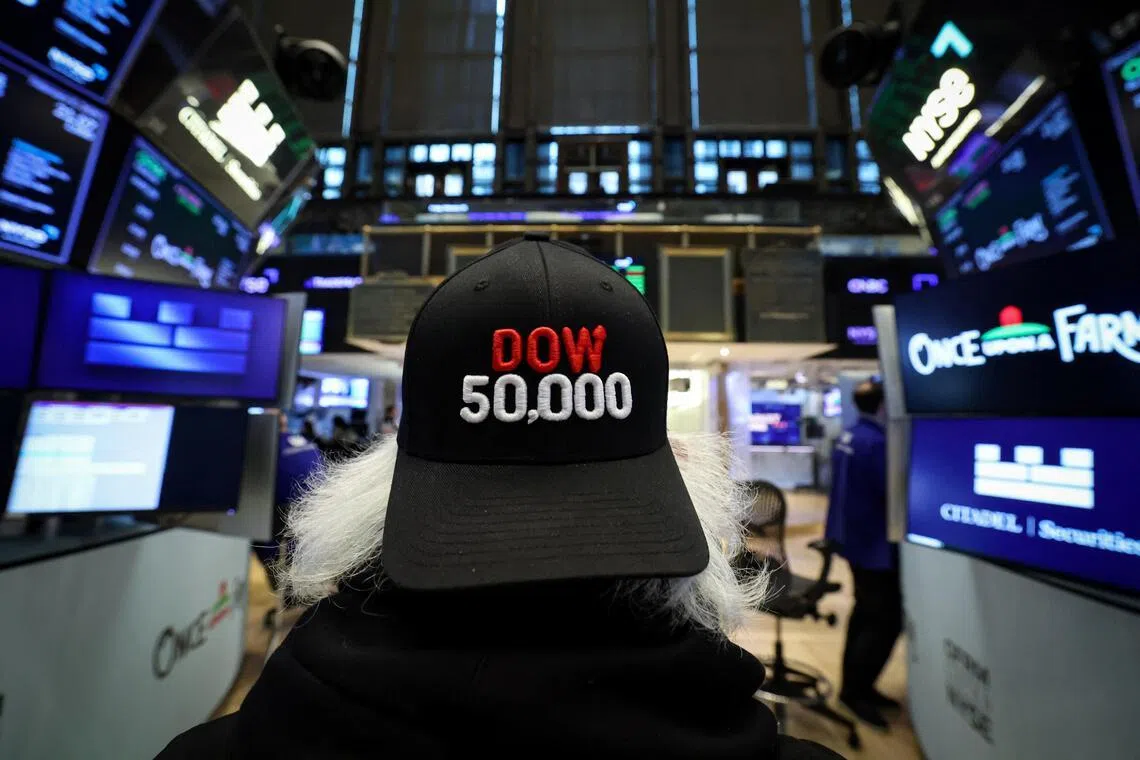 Traders working on the floor of the New York Stock Exchange, in New York City, as the Dow Jones Industrial Average surpasses the 50,000 mark.