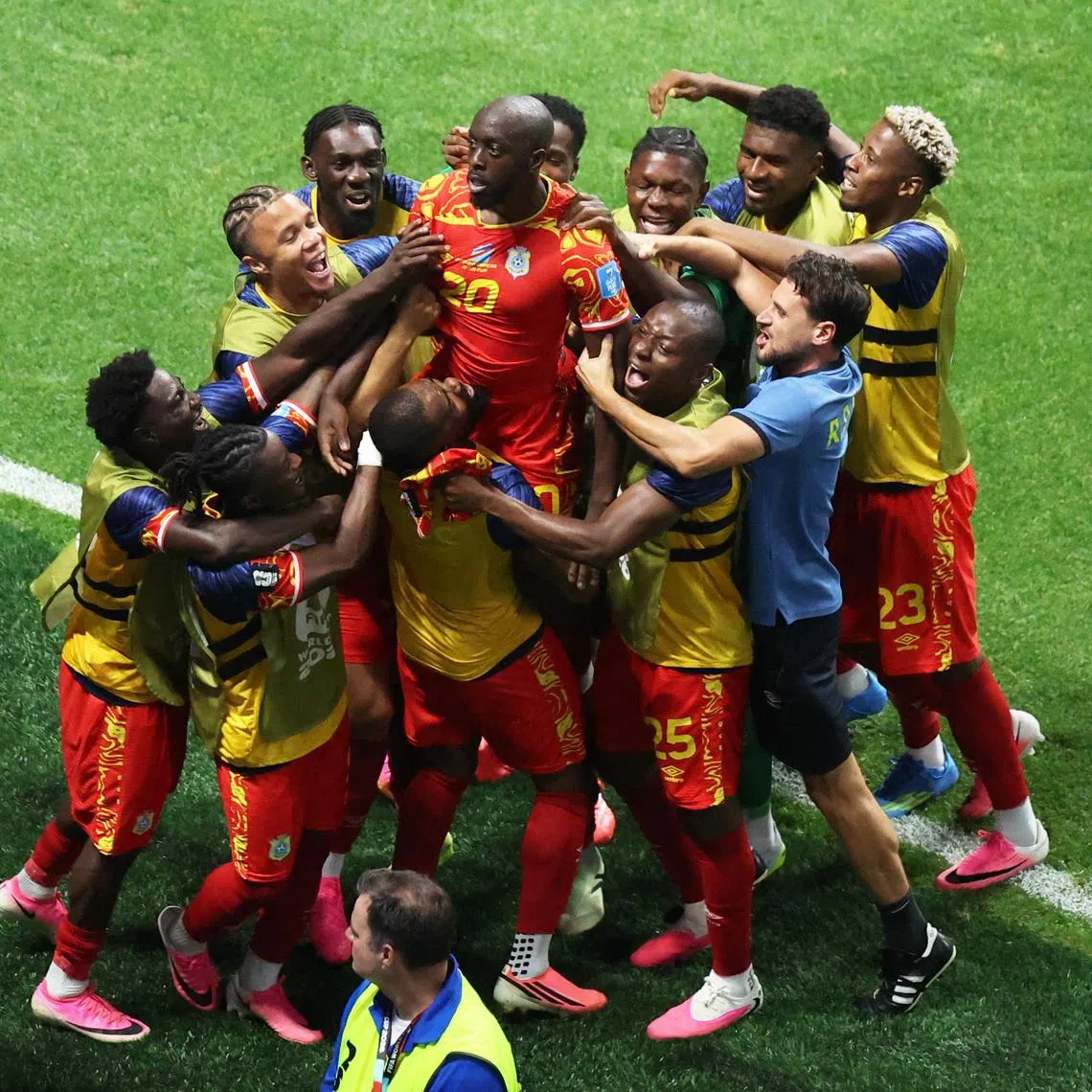 DR Congo’s Yoane Wissa celebrates scoring their third goal with his teammates.