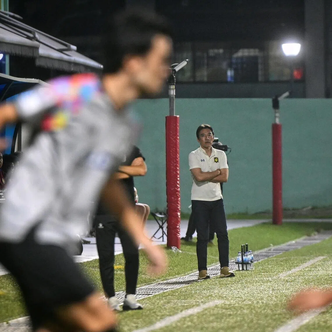 BG Tampines Rovers coach Katsuhito Kinoshi watches on with his arms folded during his team's 3-2 loss against Albirex Niigata at the Jurong East Stadium on Apr 4, 2026.