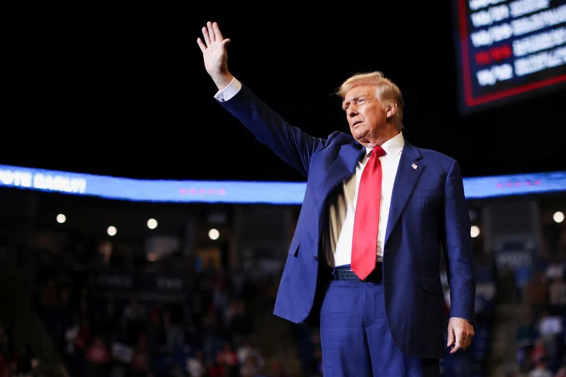 Former president Donald Trump gestures during a rally in State College in key battleground state Pennsylvania. 