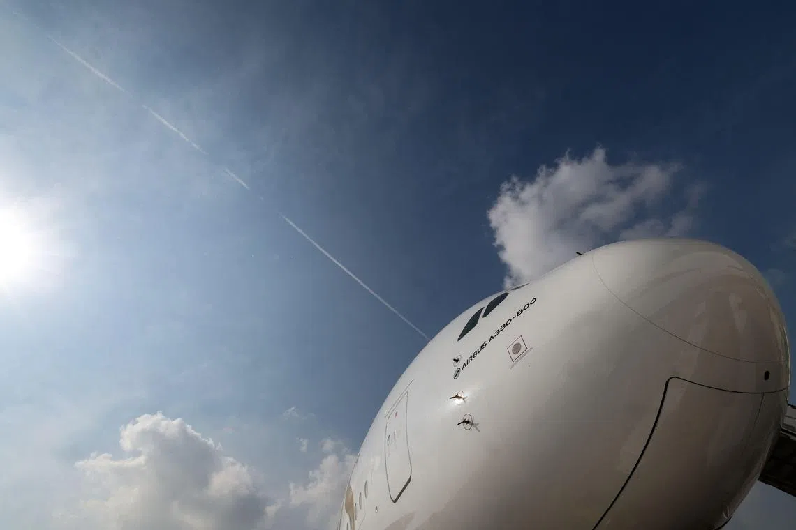 An Emirates Airbus A 380-800 aircraft, powering one of its engines with a hundred per cent Sustainable Aviation Fuel (SAF), is pictured before a demonstration flight at the Dubai International Airport in Dubai, on November 22, 2023. (Photo by Giuseppe CACACE / AFP)