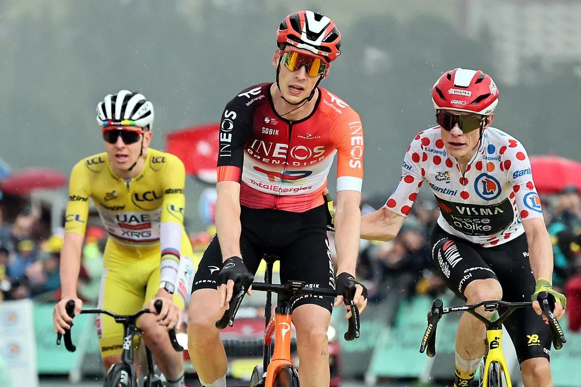 Dutch rider Thymen Arensman finishing ahead of Jonas Vingegaard and overall leader Tadej Pogacar to win the 19th stage of the Tour de France on July 25.