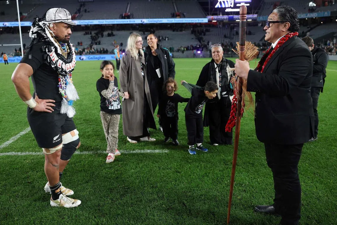 Ardie Savea of New Zealand celebrates his 100th Test appearance with former All Black Eroni Clarke following the Rugby Championship Test match against South Africa at Eden Park in Auckland on Sept 6, 2025.