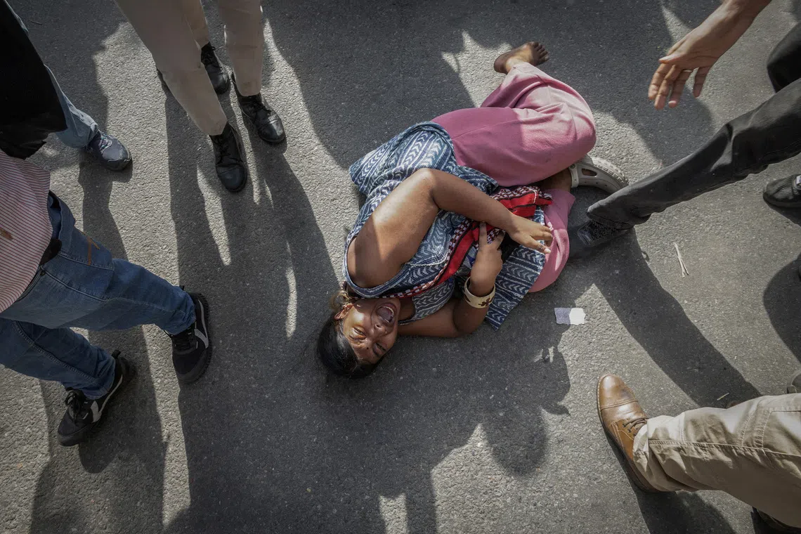 The police detaining a demonstrator during a protest demanding the resignation of India’s Chief Election Commissioner Gyanesh Kumar, in New Delhi, on Oct 3.