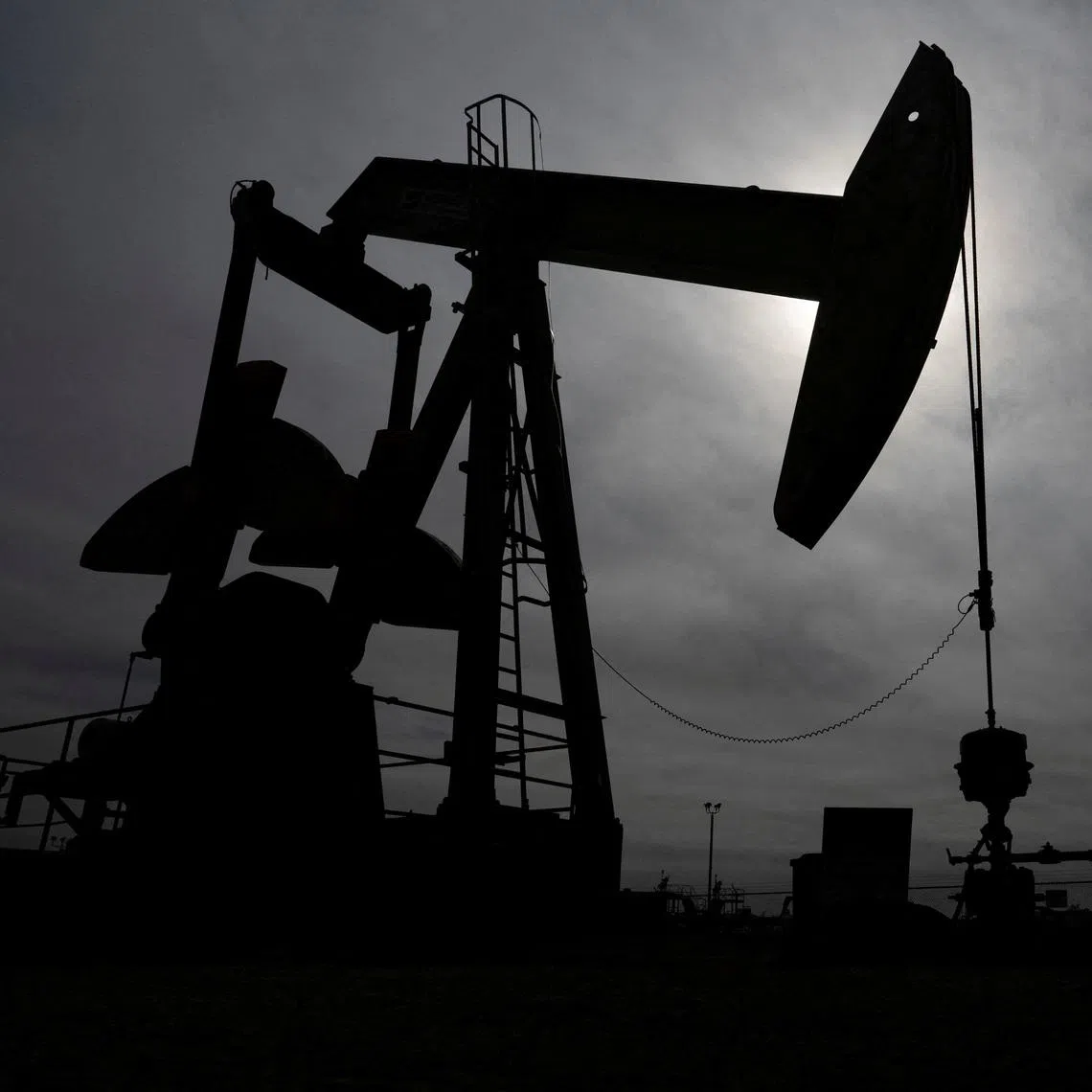 FILE PHOTO: A pump jack operates near a crude oil reserve in the Permian Basin oil field near Midland, Texas, U.S. February 18, 2025.  REUTERS/Eli Hartman/File Photo