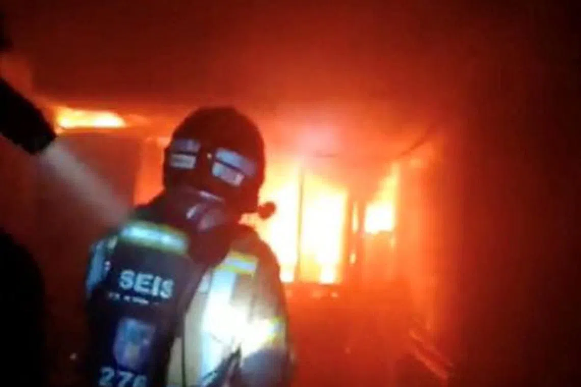 Firefighters work to control flames inside a nightclub in Murcia, Spain, October 1, 2023, in this screen grab obtained from a handout video. Murcia Firefighters/Handout via REUTERS    THIS IMAGE HAS BEEN SUPPLIED BY A THIRD PARTY