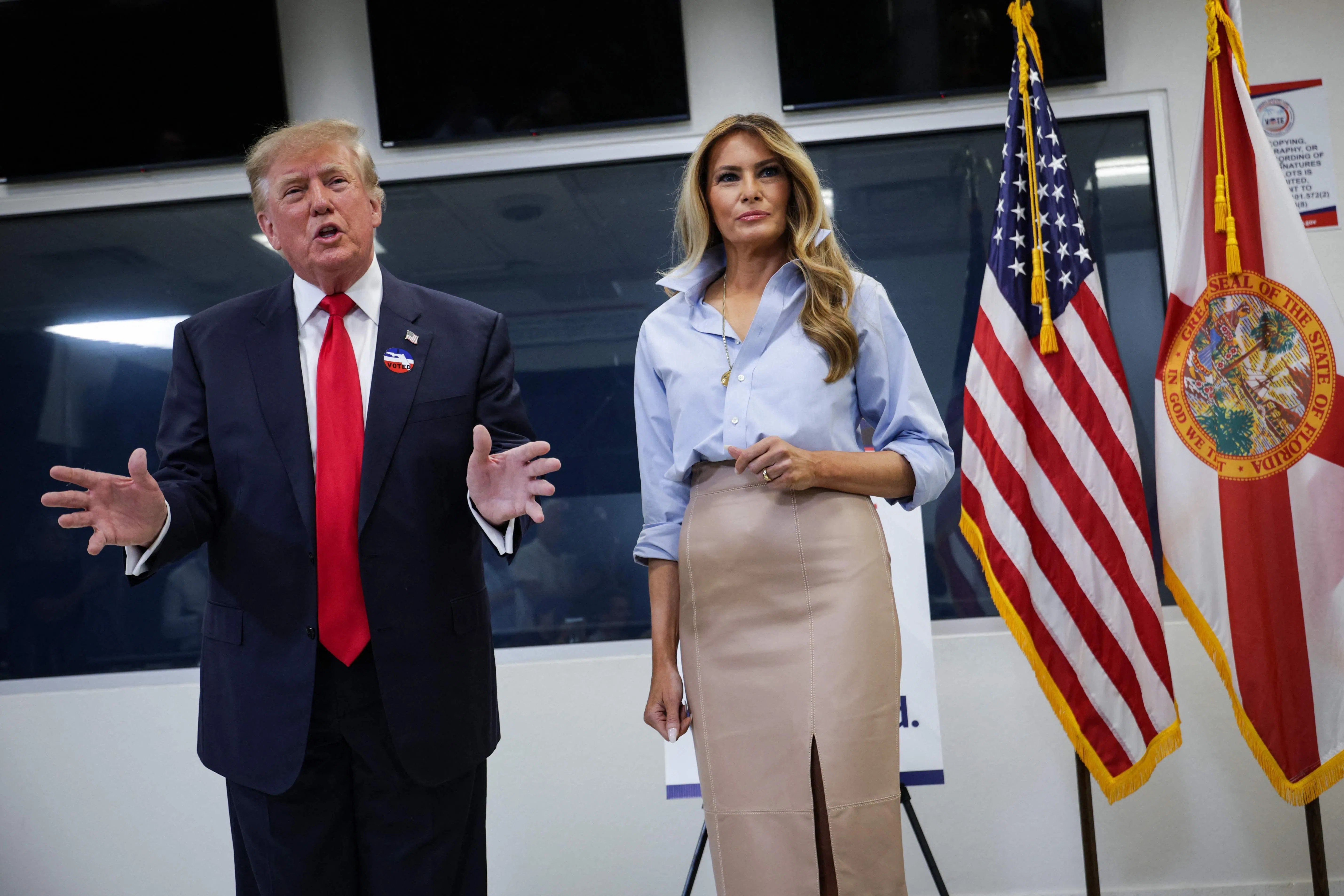 WEST PALM BEACH, FLORIDA - OCTOBER 24: U.S. President Donald Trump (L) speaks to reporters alongside first lady Melania Trump after they cast their ballots during early voting at the Palm Beach County Supervisor of Elections on October 24, 2026 in West Palm Beach, Florida. The U.S. will hold midterm elections on November 3. Alex Wong/Getty Images/AFP (Photo by ALEX WONG / GETTY IMAGES NORTH AMERICA / Getty Images via AFP)