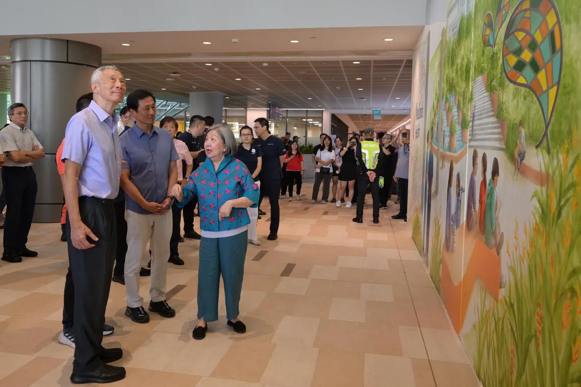 (From left) SM Lee Hsien Loong, Health Minister Ong Ye Kung and Woodlands Health Development board committee chairman Jennie Chua at the campus' official opening on July 13.