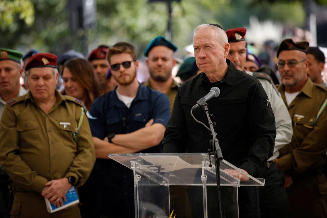FILE PHOTO: Israeli Defense Minister Yoav Gallant speaks at a ceremony for soldier Colonel Asaf Hamami at his funeral in Tel Aviv, Israel December 4, 2023. REUTERS/Shir Torem/File Photo