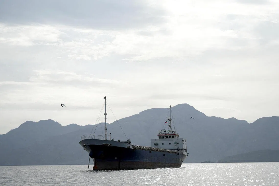 A vessel in the Strait of Hormuz, off the coast of Oman’s Musandam province, on April 12, 2026.