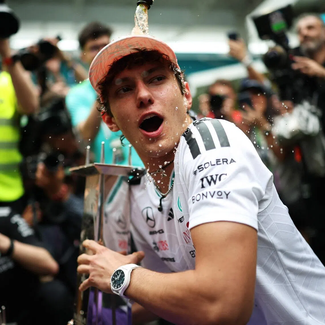 Mercedes' Italian driver Kimi Antonelli celebrating his Miami Grand Prix victory, his third in a row, with his team on May 3. 