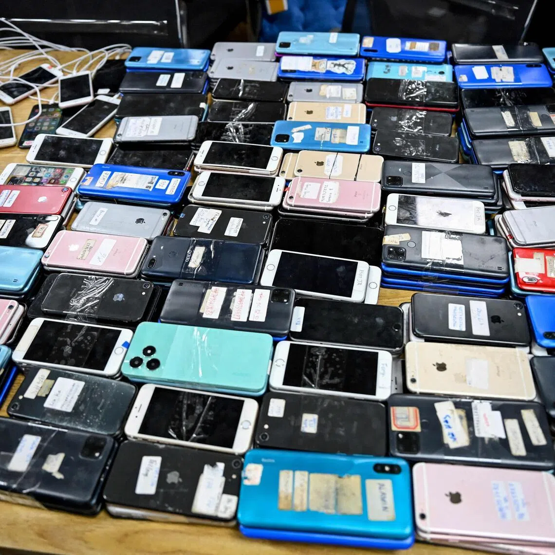 Seized smartphones seized from a cyberscam operation centre pictured on March 11.