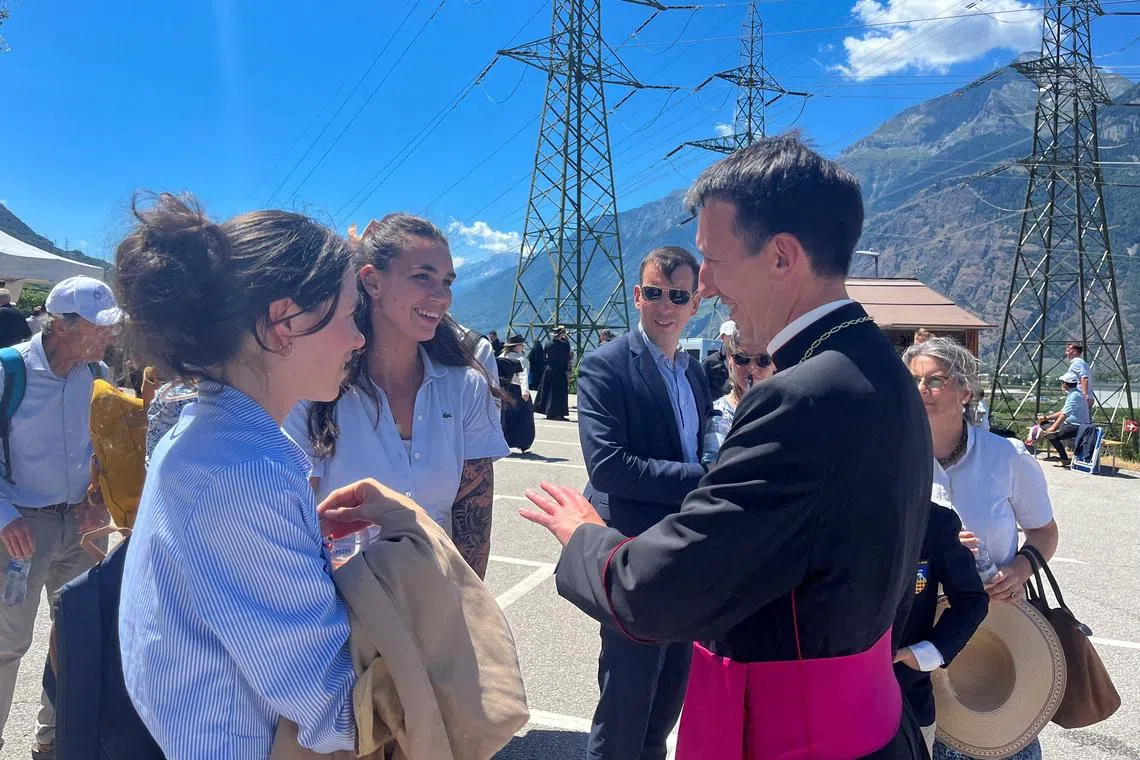 Michel Poinsinet de Sivry, one of the newly-ordained bishops of the Swiss-based Society of Saint Pius X, greets people in Econe, Switzerland, July 2, 2026. REUTERS/Emma Farge
