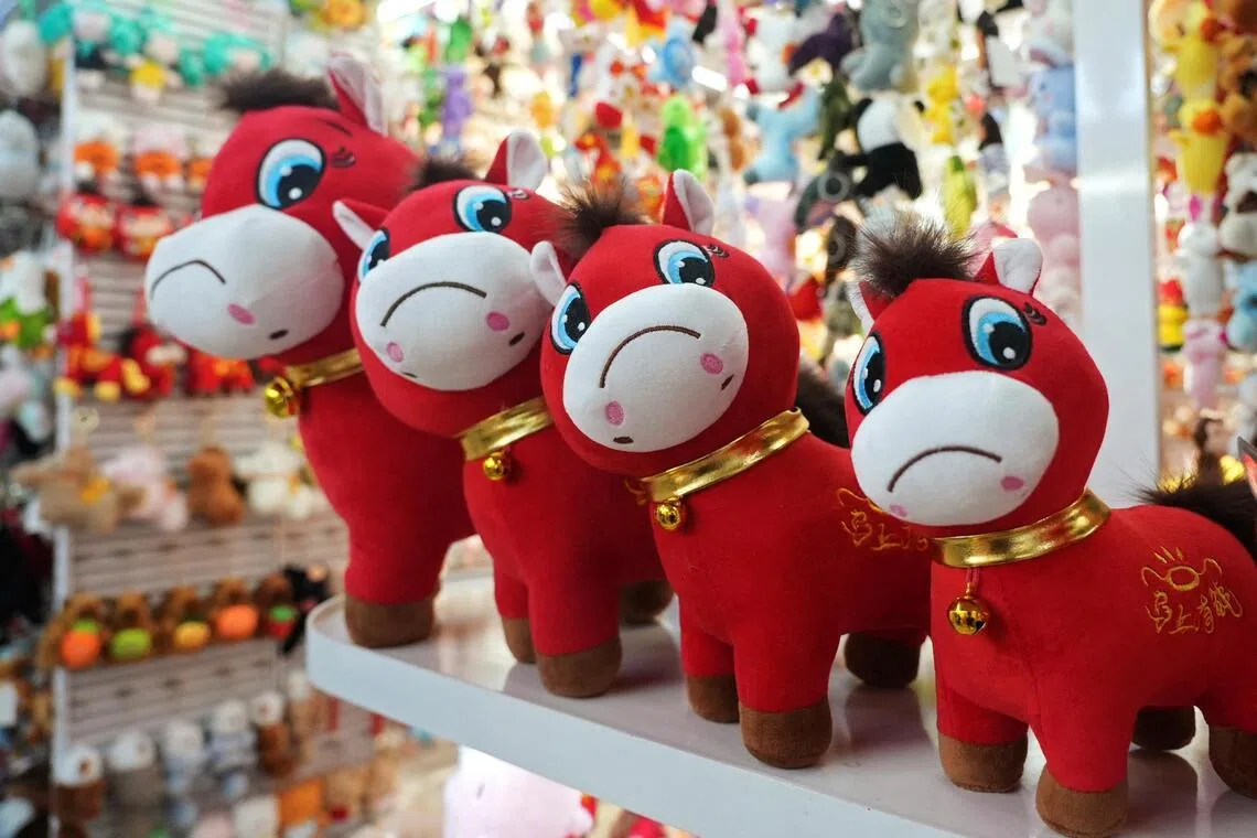 Crying horse plush toys sit on display ahead of the Chinese Lunar New Year, in Yiwu, China, on Jan 21.