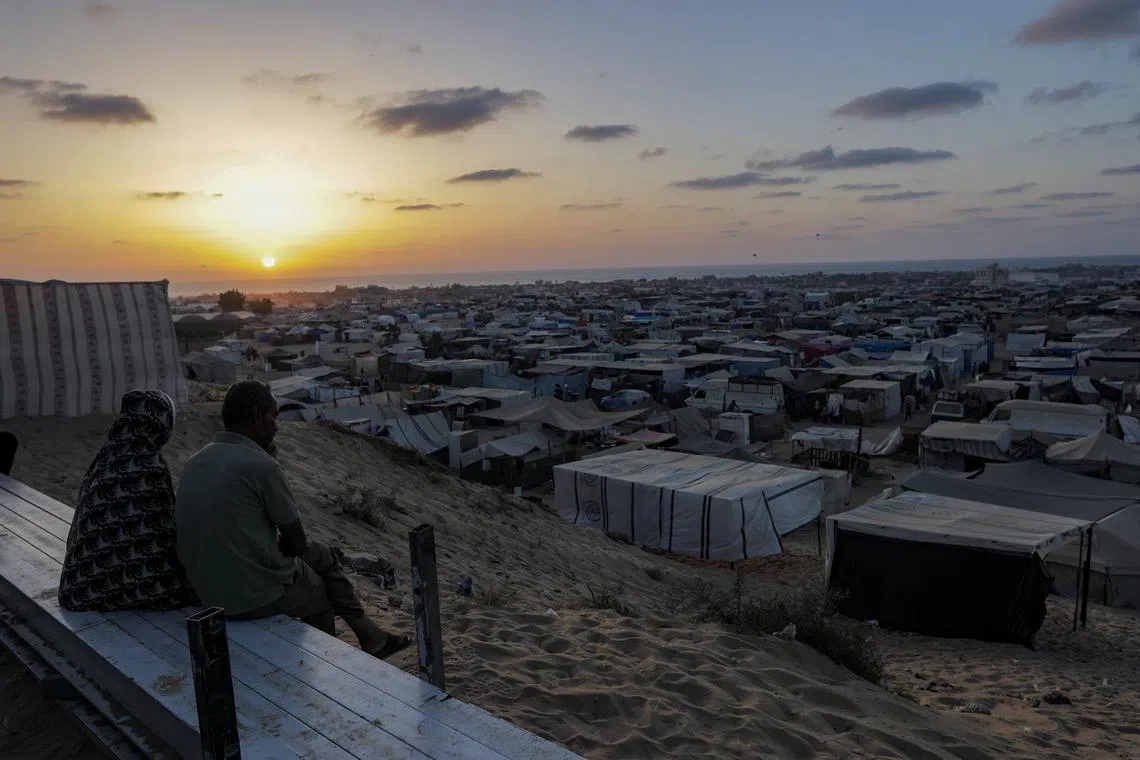 Displaced Palestinians placing their tents in the Khan Yunis camp in the southern Gaza Strip, after their evacuation from the city of Rafah, in the southern Gaza Strip, on June 18, 2024. 