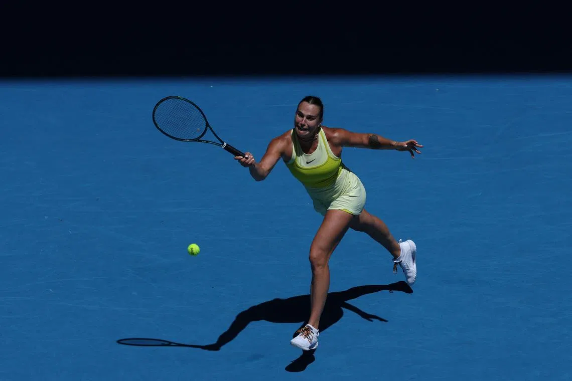 Belarus' Aryna Sabalenka hits a return against Denmark’s Clara Tauson during their women's singles match at the Australian Open.