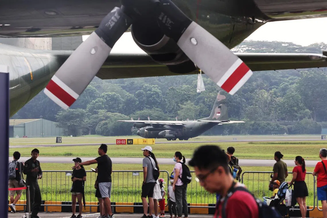 Members of the public enjoying the tour of various military aircraft at the static display section of the RSAF Open House 2023 at the Paya Lebar Air Base on Sept 9. 