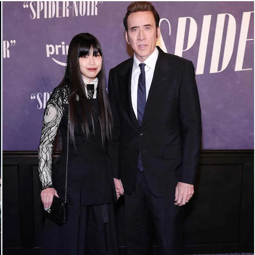 (From left) Nicolas Cage in Spider-Noir, Nicolas Cage and his wife Riko Shibata at the Spider-Noir premiere on May 13.