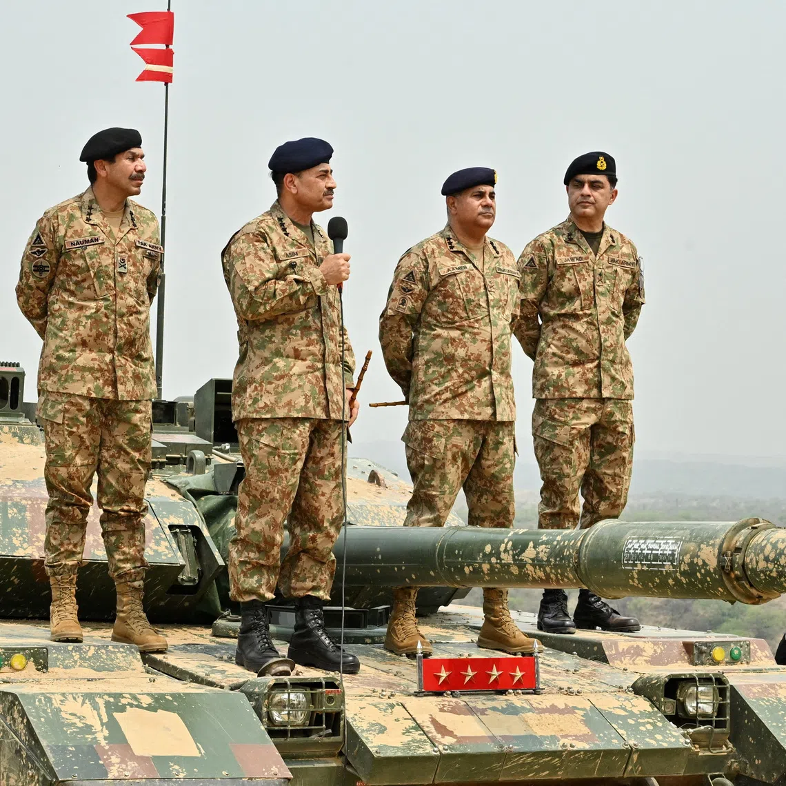 FILE PHOTO: Chief of Army Staff of Pakistan Asim Munir holds a microphone during his visit at the Tilla Field Firing Ranges (TFFR) to witness the Exercise Hammer Strike, a high-intensity field training exercise conducted by the Pakistan Army's Mangla Strike Corps, in Mangla, Pakistan May 1, 2025. Inter-Services Public Relations (ISPR)/Handout via REUTERS
