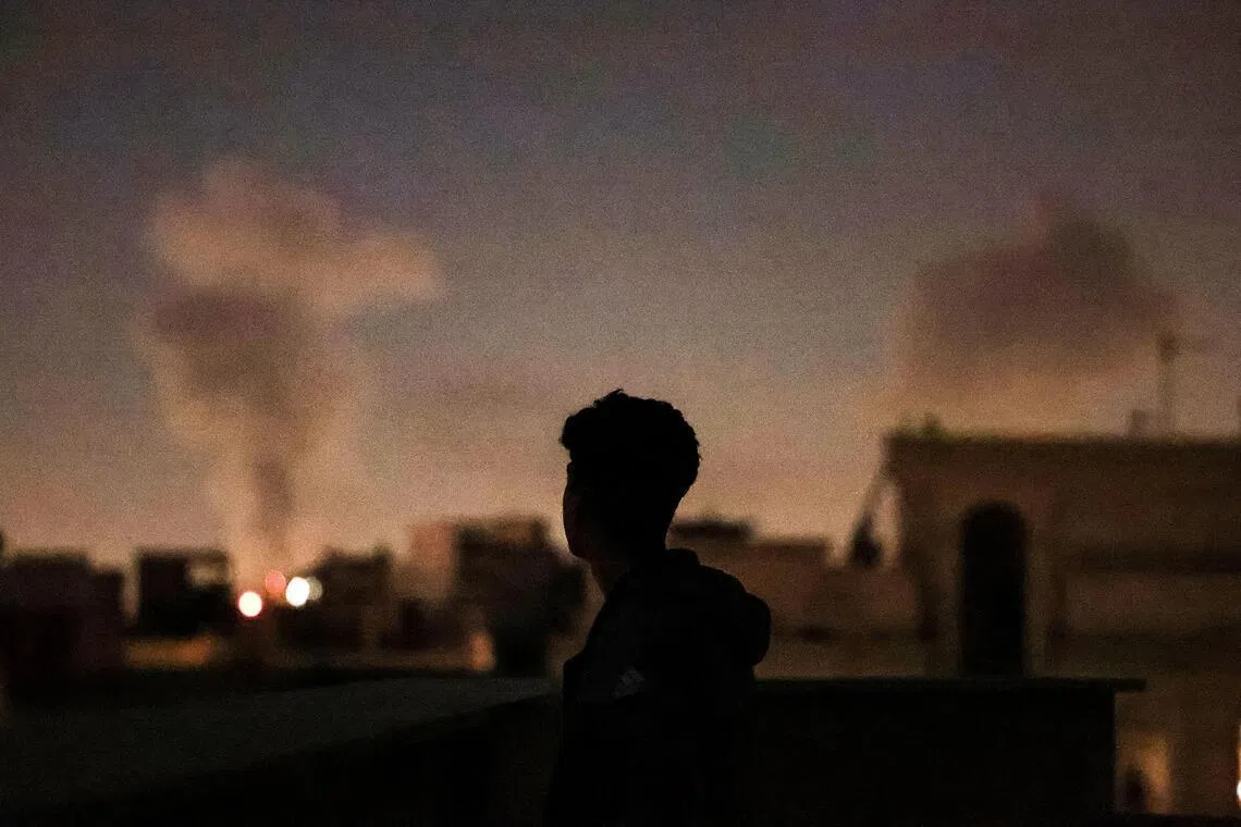 A plume of smoke rising after a strike on Tehran on March 4.