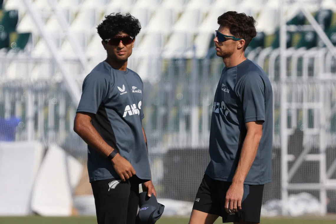 Cricket - ICC Men's Champions Trophy - New Zealand Practice - Rawalpindi Cricket Stadium, Rawalpindi, Pakistan - February 23, 2025 New Zealand's Rachin Ravindra and Mitchell Santner during practice REUTERS/Akhtar Soomro