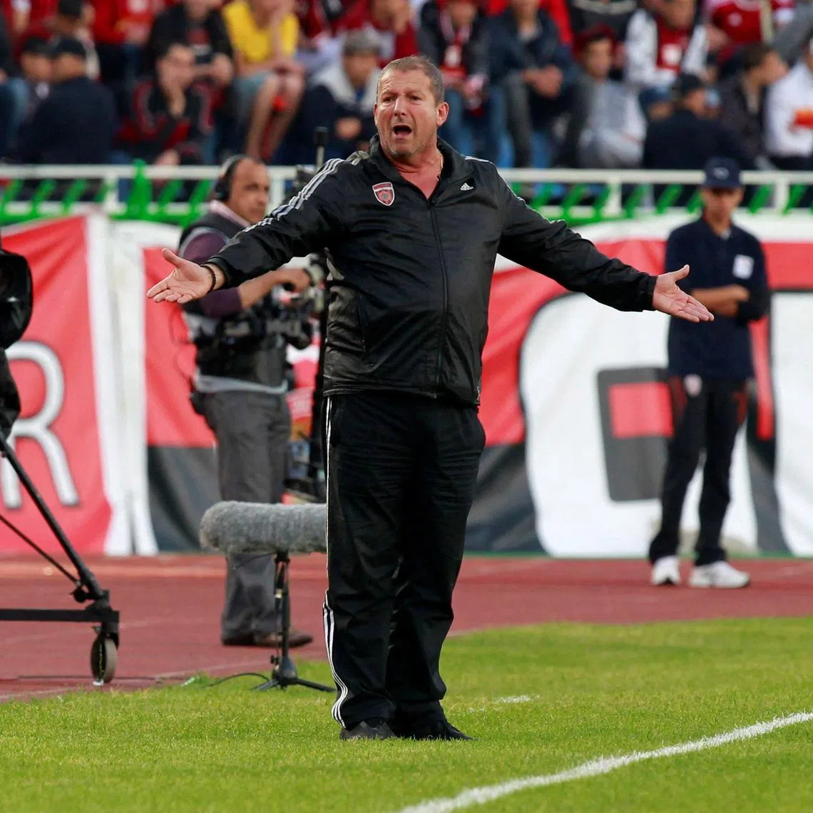 FILE PHOTO: Coach Rolland Courbis of Algeria's USM Alger gestures during the Union of Arab Football Associations (UAFA) final soccer match against Kuwait's Al-Arabi in Algiers May 14, 2013. REUTERS/Louafi Larbi/File Photo