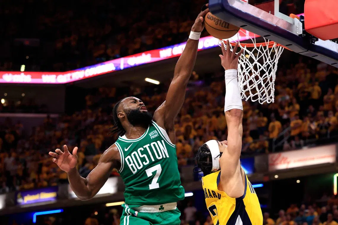 Jaylen Brown of the Boston Celtics blocks Andrew Nembhard of the Indiana Pacers during the fourth quarter in Game 4 of the NBA Eastern Conference Finals.