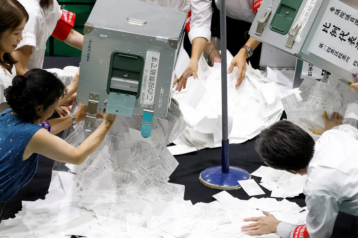Election officials at a counting centre in Tokyo during Japan's upper house elections in July.