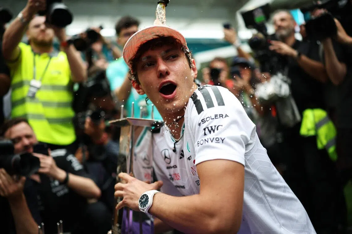 Mercedes' Italian driver Kimi Antonelli celebrating his Miami Grand Prix victory, his third in a row, with his team on May 3. 