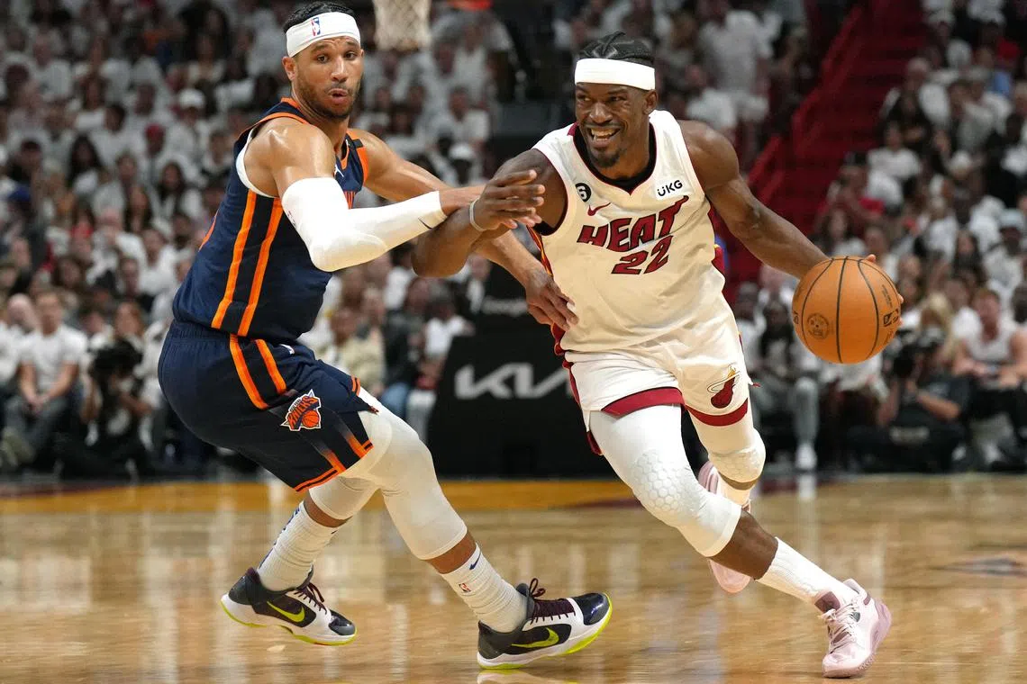 Miami Heat forward Jimmy Butler driving past New York Knicks guard Trevor Keels in the second half during game six of the 2023 NBA playoffs at Kaseya Cente.