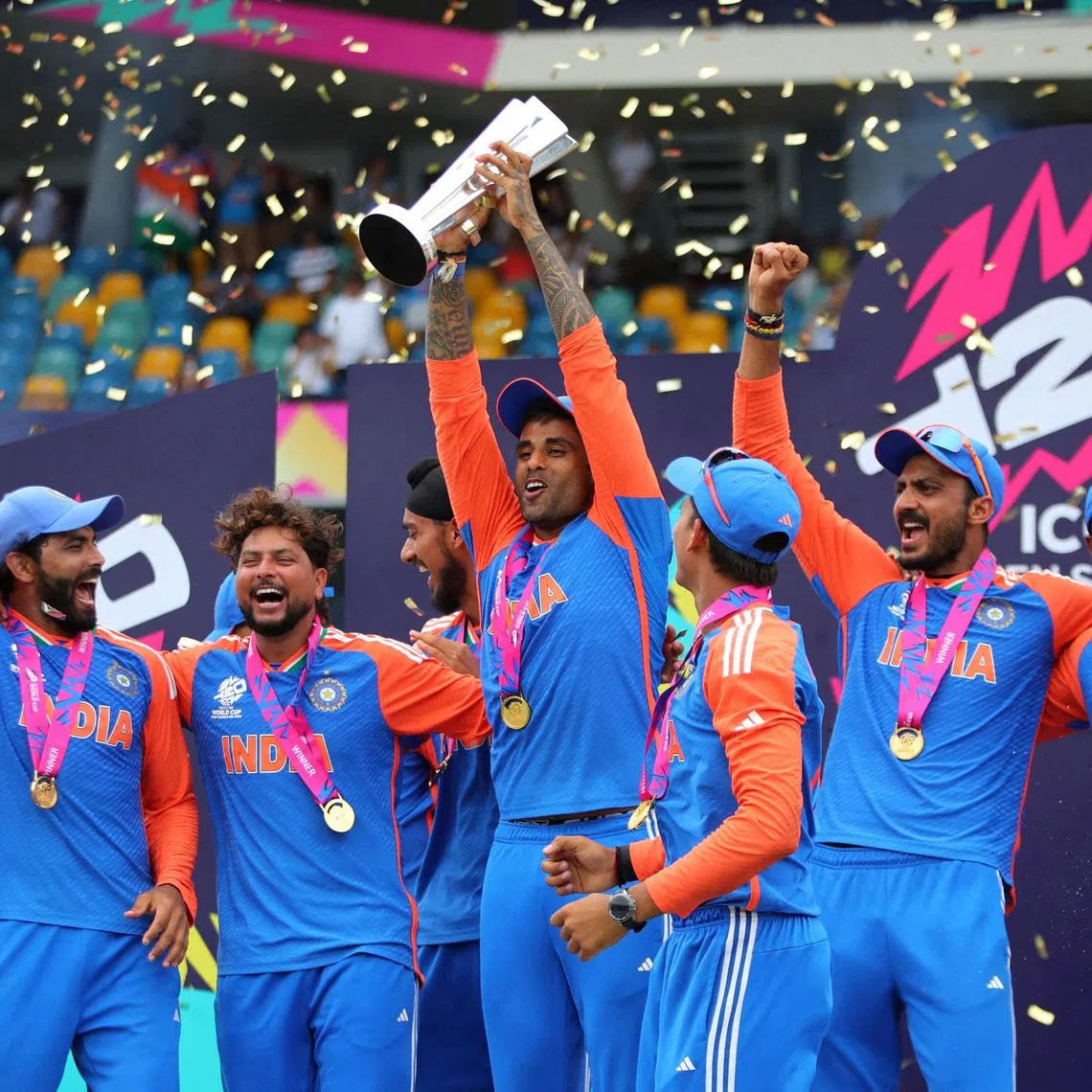 FILE PHOTO: Cricket - ICC T20 World Cup 2024 - Final - India v South Africa - Kensington Oval, Bridgetown, Barbados - June 29, 2024 India's Surya Kumar lifts the trophy as they celebrate after winning the T20 World Cup REUTERS/Ash Allen/File Photo