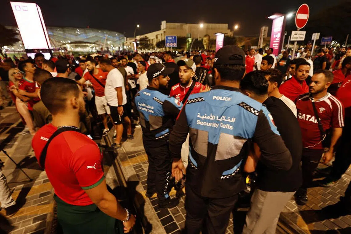 Fans clash with police officers outside the stadium before the match between Morocco and Spain on Dec 6, 2022.