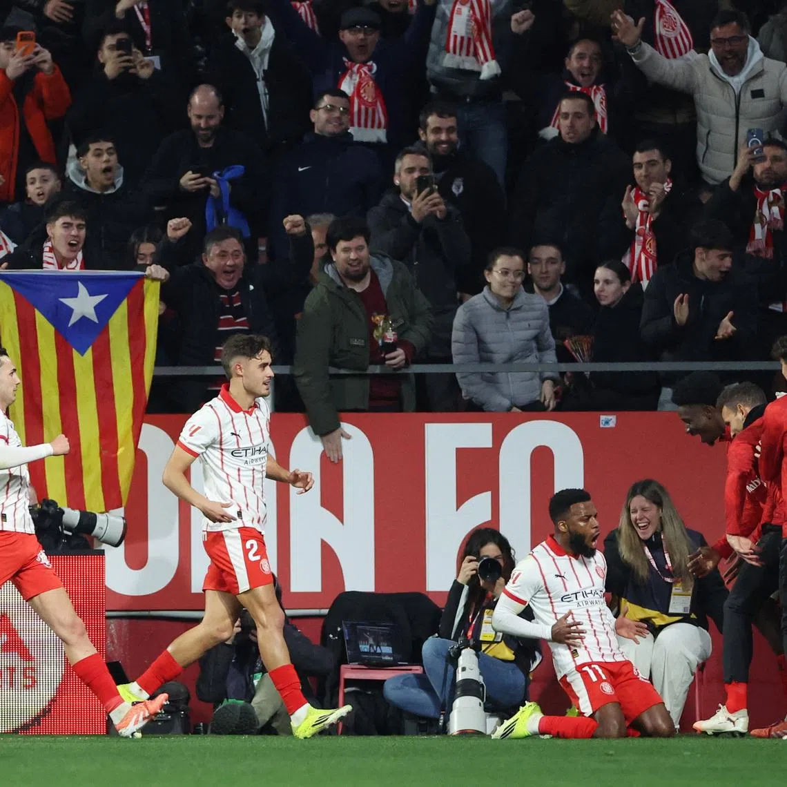 Soccer Football - LaLiga - Girona v FC Barcelona - Estadi Montilivi, Girona, Spain - February 16, 2026 Girona's Thomas Lemar celebrates scoring their first goal with teammates REUTERS/Bruna Casas
