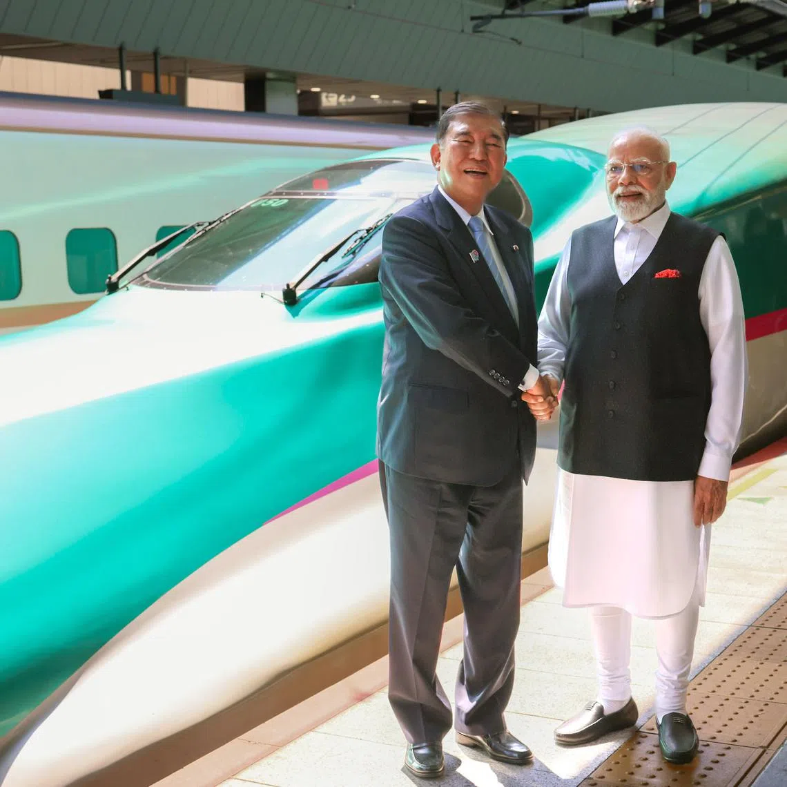Japanese Prime Minister Shigeru Ishiba (left) and Indian Prime Minister Narendra Modi shaking hands on Aug 30.