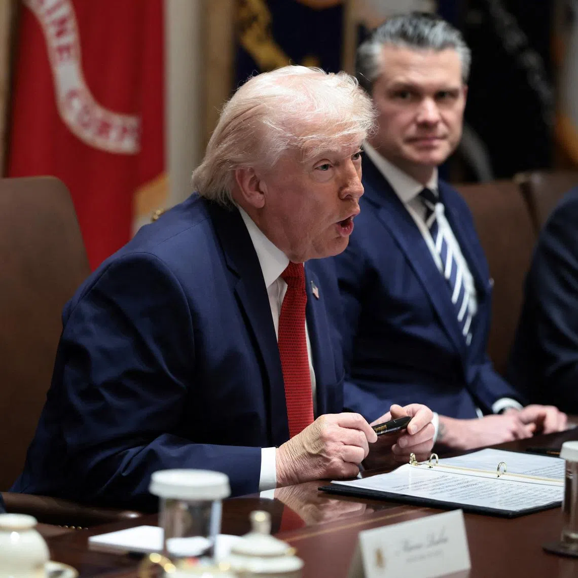 U.S. President Donald Trump holds a Sharpie pen that was custom-made for the White House, during a cabinet meeting at the White House in Washington, D.C., U.S., March 26, 2026. REUTERS/Evelyn Hockstein