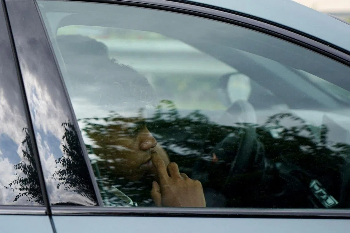 Barcelona's Spanish forward Lamine Yamal is pictured in a car as he leaves German Trias i Pujols hospital, Can Ruti, near Badalona on August 15, 2024. Police arrested three suspects and seek a fourth after the father of teenage Spain and Barcelona star Lamine Yamal was stabbed and left in a serious but stable condition, Spanish newspaper La Vanguardia reported late on August 14, 2024. Mounir Nasraoui was stabbed multiple times in a car park in Mataro after an argument with some men while he was walking his dog, who later came back to attack him, said the report, citing "official sources familiar with the incident". (Photo by Manaure Quintero / AFP)
