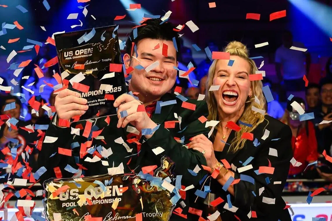 Singapore's Aloysius Yapp celebrates with Matchroom Multi Sport chief executive officer Emily Fraser after he captures his first US Open crown and becomes the first player to win three straight Matchroom major titles.