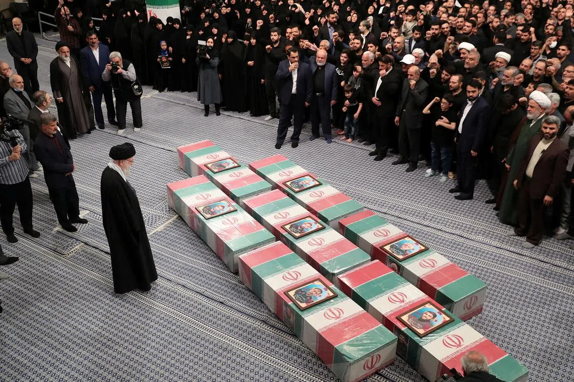 FILE PHOTO: Iran's Supreme Leader, Ayatollah Ali Khamenei looks at the coffins of members of the Islamic Revolutionary Guard Corps who were killed in the Israeli airstrike on the Iranian embassy complex in the Syrian capital Damascus, during a funeral ceremony in Tehran, Iran April 4, 2024. Office of the Iranian Supreme Leader/WANA (West Asia News Agency)/Handout via REUTERS/File Photo