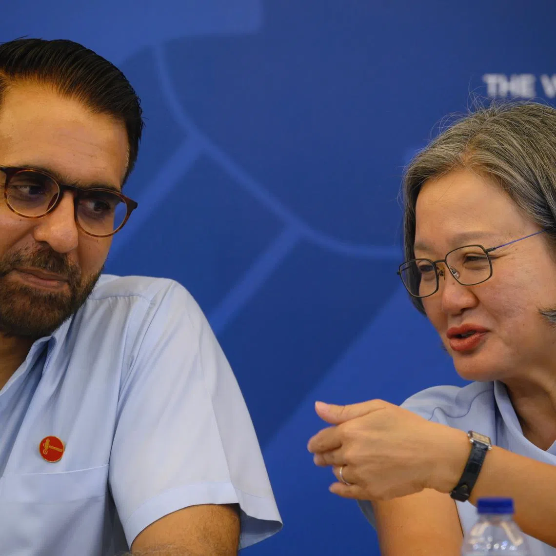 Workers' Party chief Pritam Singh and chair Sylvia Lim have a word with each other during a press conference at their Geylang headquarters on April 18.