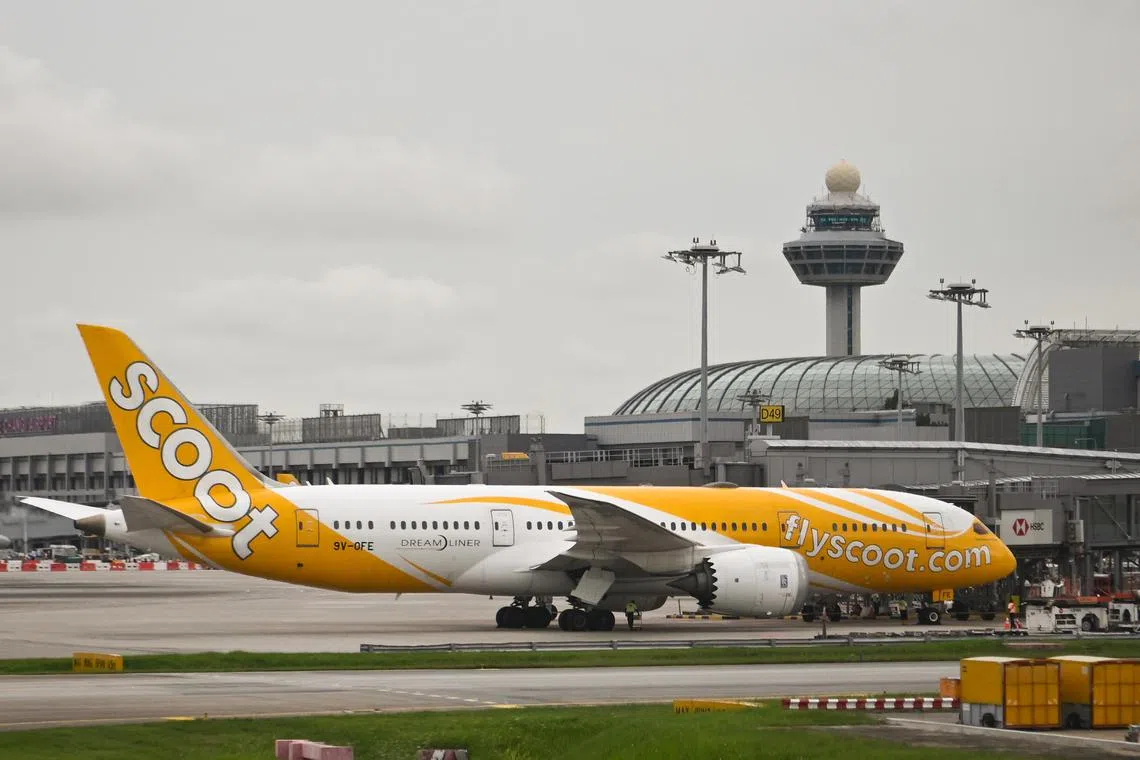 ST20220620-202208166663-Lim Yaohui-pixgeneric/
Generic photograph of Scoot aeroplane, Changi Airport control tower and Jewel Changi Airport at Changi Airport on June 20, 2022.
Can be used for stories on carrier, commercial, airline, plane, oil, pollution, air, aviation, airport, fuel, travel, business and money.
(ST PHOTO: LIM YAOHUI)